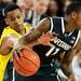 Michigan sophomore Trey Burke reaches in for the steal from Michigan State junior Keith Appling in the second half against Michigan State at Crisler Center on Sunday, March 3, 2013. Melanie Maxwell I AnnArbor.com